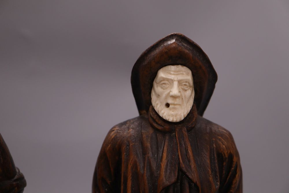 Two carved wood figures of workmen, with ivory faces, signed Neri, height 31cm